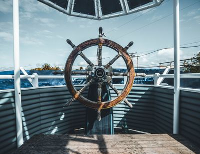 A ship's wheel in the bow.