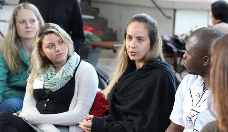 Students sitting in a circle talking