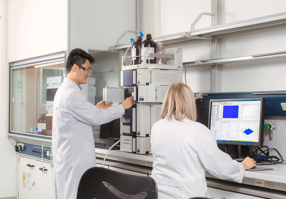 enlarge the image: Scientists using high-performance liquid chromatography instrumentation