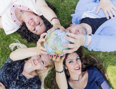 International students with a globe