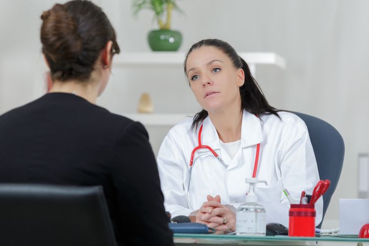 Female doctor talking to a patient.