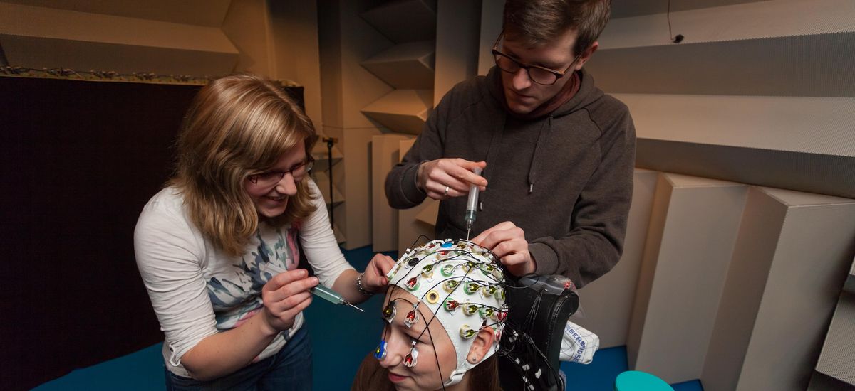 Neurobiology students preparing a subject for EEG recording